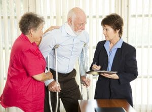 Injured man consulting an attorney about a lawsuit.