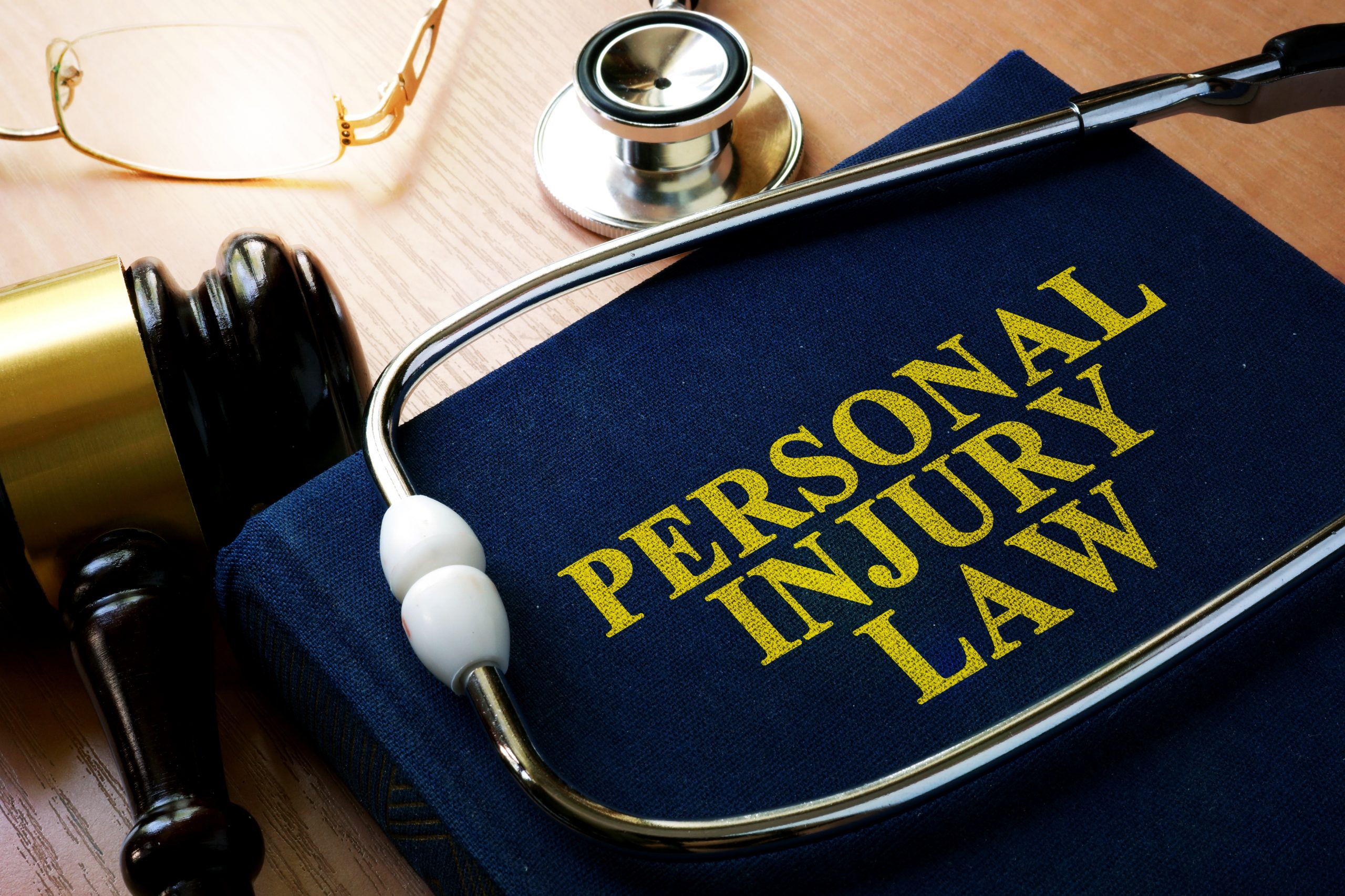 Personal Injury Law concept. Book and stethoscope.