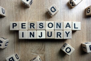 Personal injury text from wooden blocks on desk