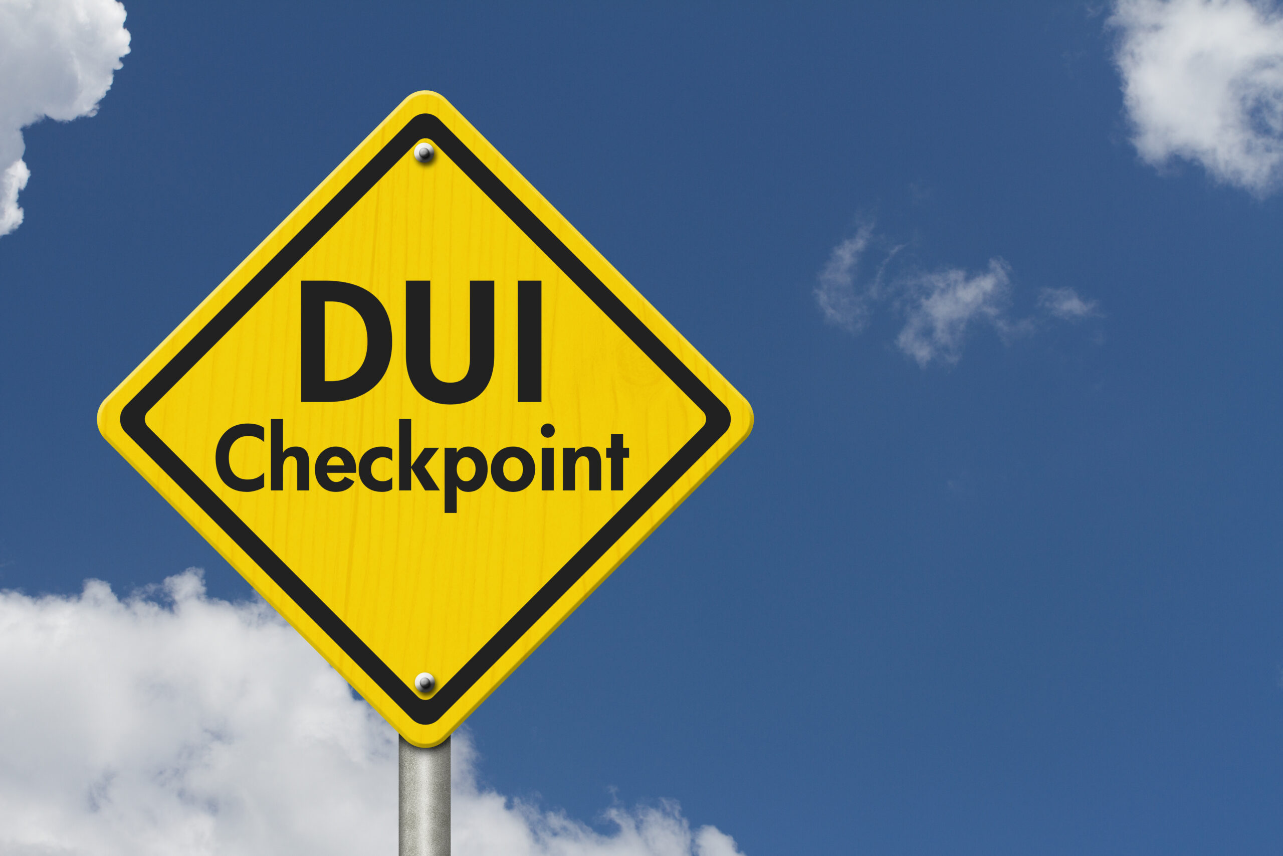 Yellow Warning DUI Checkpoint Highway Road Sign, Red, Yellow Warning Highway Sign with words DUI Checkpoint with sky background