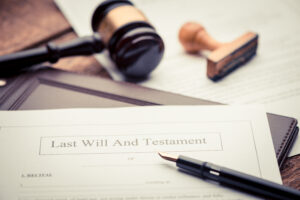 Last Will and testament document on wooden table close up